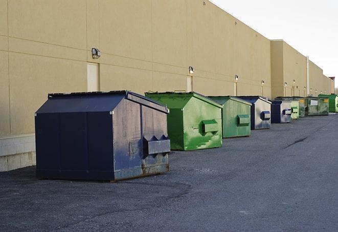 a row of industrial dumpsters at a construction site in Arlington, VA